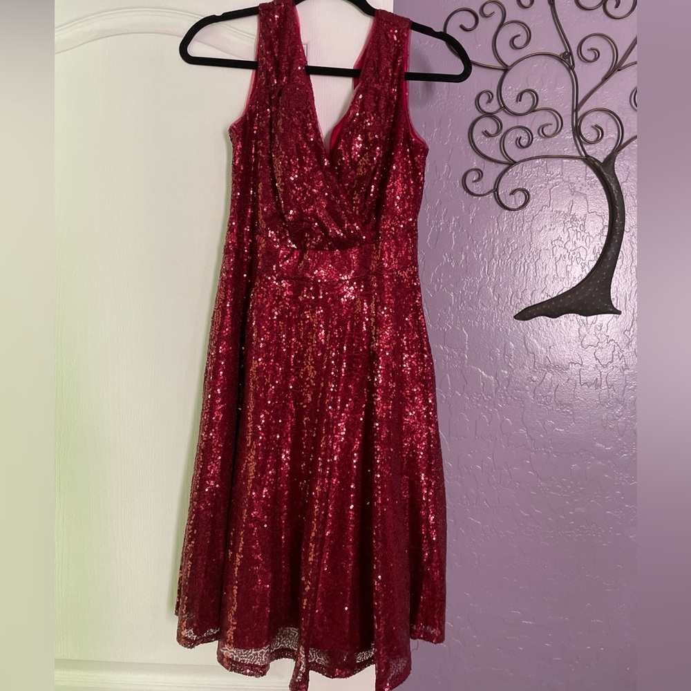Woman’s red sequin cocktail dress